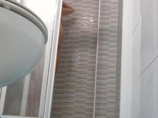 Spying on sedusive Wife Shaving Pussy in Shower